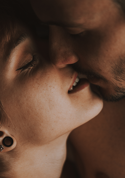 close up young couple kissing 1