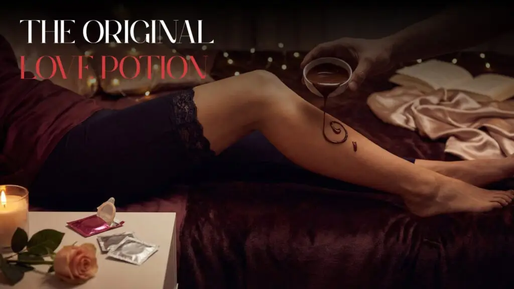 Blog banner reading The Original Love Potion, with chocolate, candles and a rose by a bed